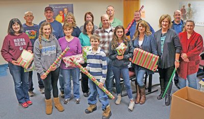 Phillips 66 employees and their families volunteered at YBGR by wrapping Christmas gifts for youth in 2015.